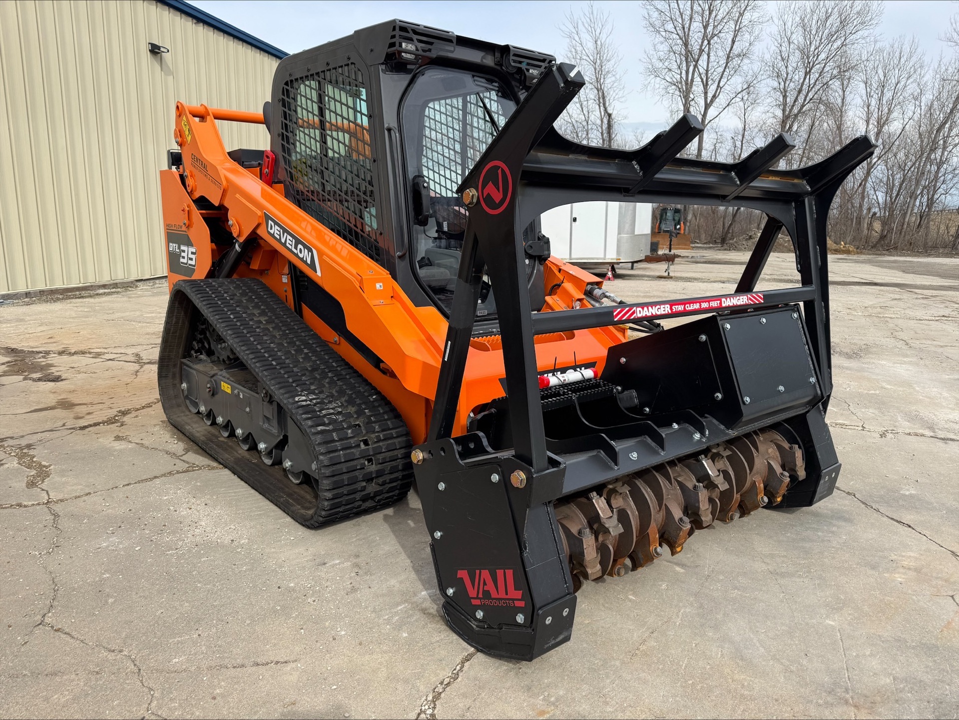 Develon DT135 with VAIL forestry mulcher — front angle