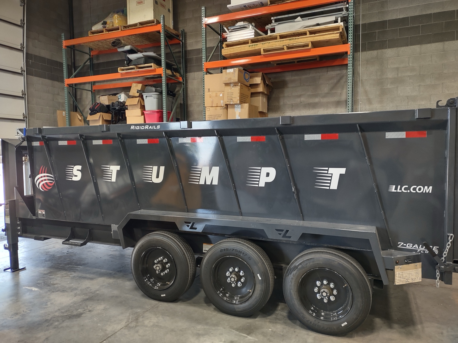 Stumpt LLC branded gooseneck dump trailer